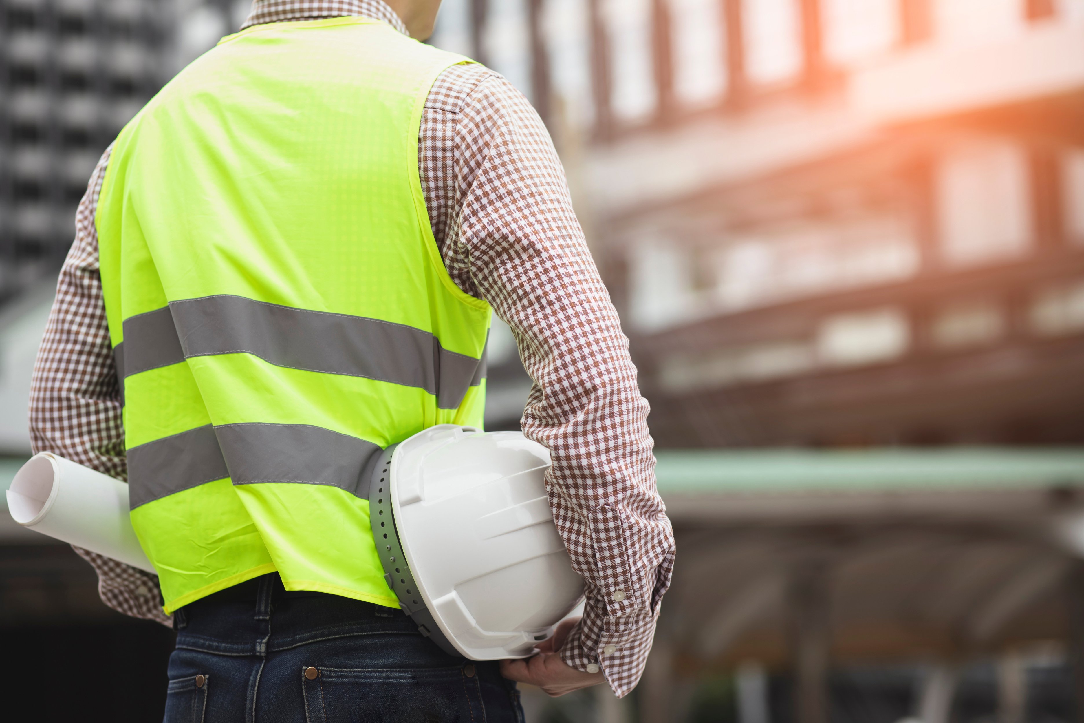 Engineer Model with White Safety Helmet for Concrete City Work Safety Project